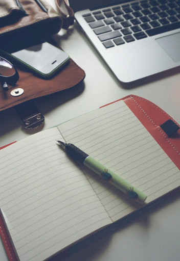 laptop bag notebook and pen